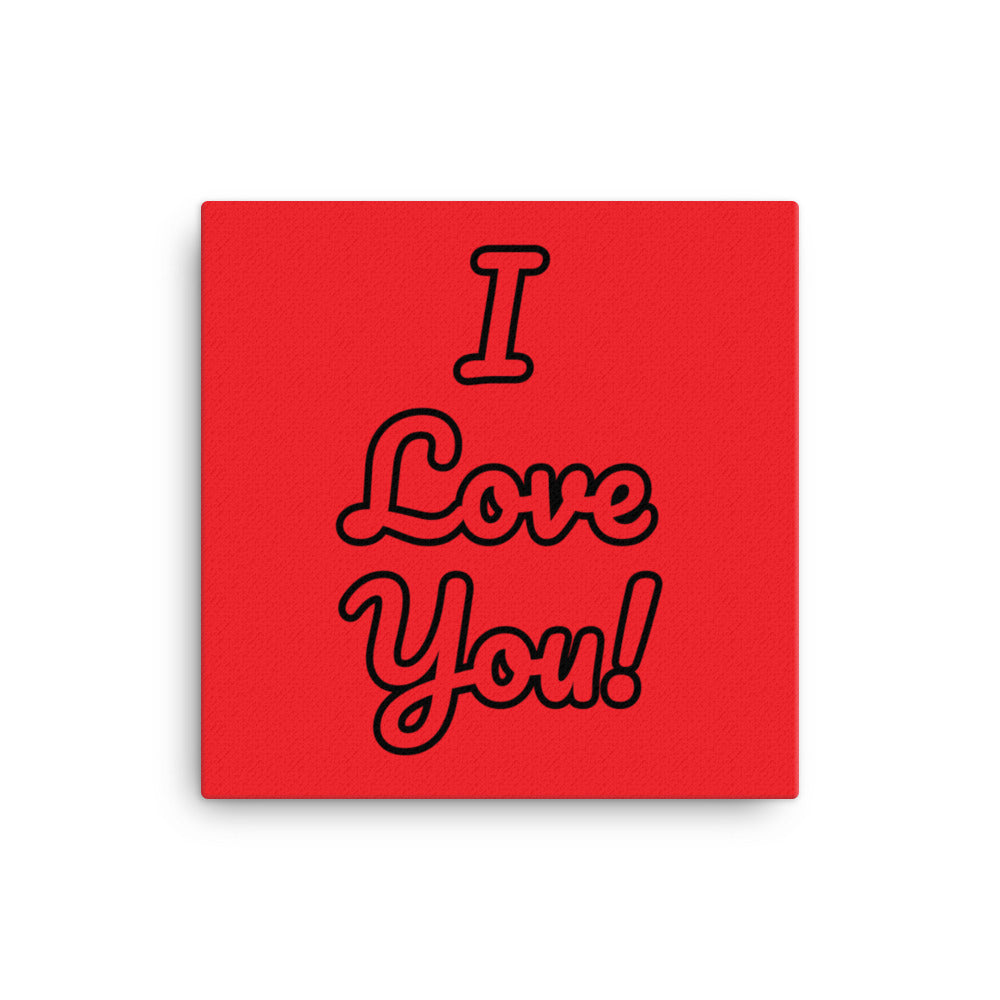 A red canvas wall art with the text 'I love you!' displayed on a white wall above a red couch, with black hanging lights and a white brick wall in the background.