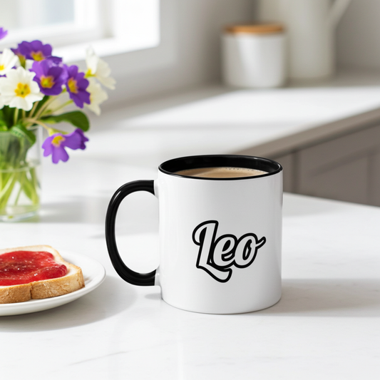 White mug with 'Leo' on a table with toast and flowers