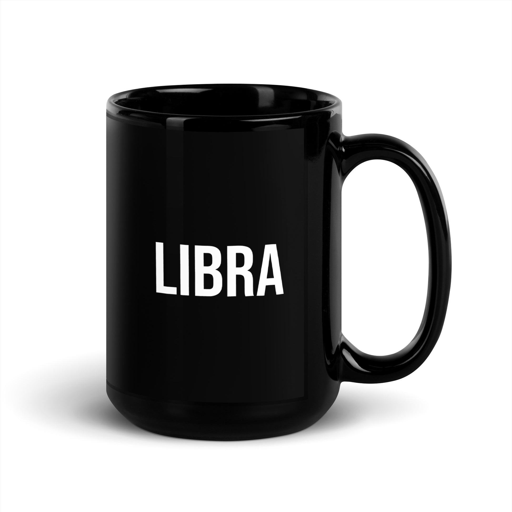 Black mug with Libra printed on it against a white background