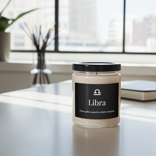 Candle jar labeled 'Libra' on a table with a cityscape in the background