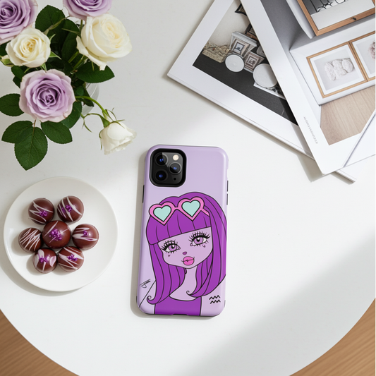 Phone case with an Aquarius character design on a table with flowers and chocolates