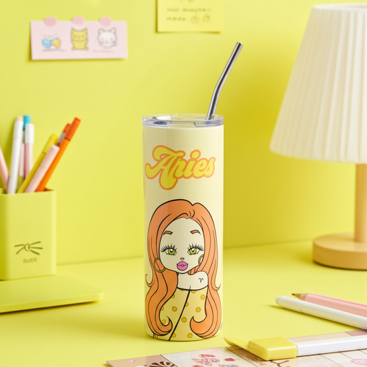 Tumbler with an Aries cartoon character design on a yellow desk with stationery items.