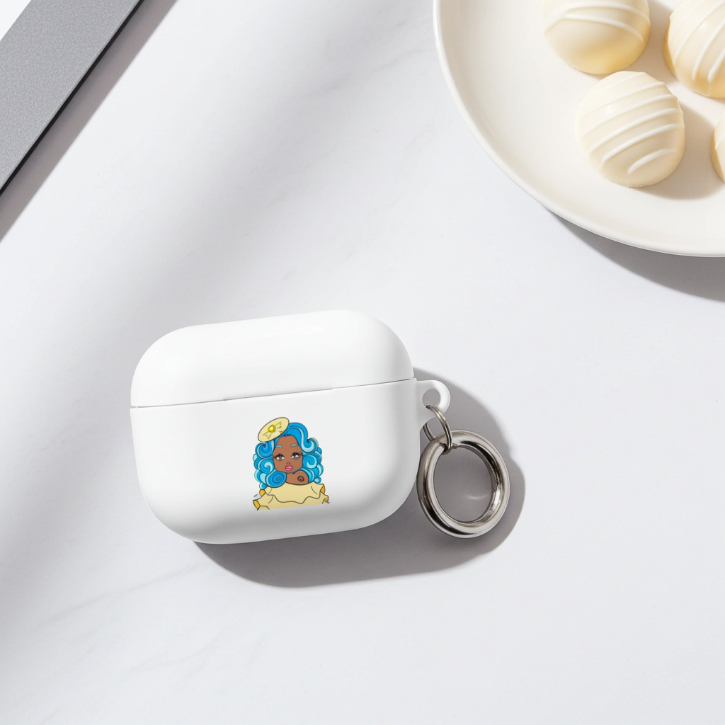 White air pod case with a keychain featuring an illustration of a cancerian character with blue hair on a white surface.