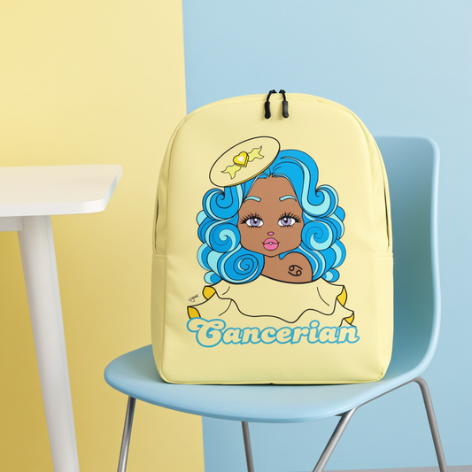 Yellow backpack with a cartoon character and 'Cancerian' text on a blue chair against a yellow and blue wall.