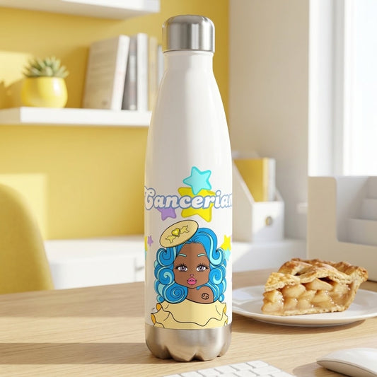 A white insulated water bottle with a silver cap and base, featuring a colorful cartoon illustration of a woman with blue hair and the word 'Bancerian' on the front, standing on a wooden desk in a bright room with a pie on a plate in the background.