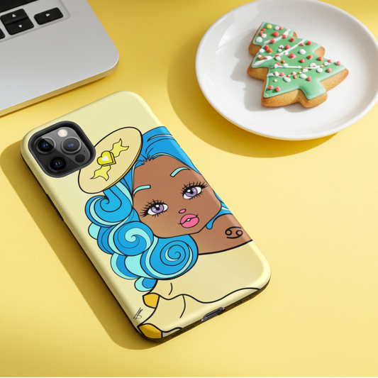 Phone case with cartoon character on a yellow surface with a laptop and cookies.