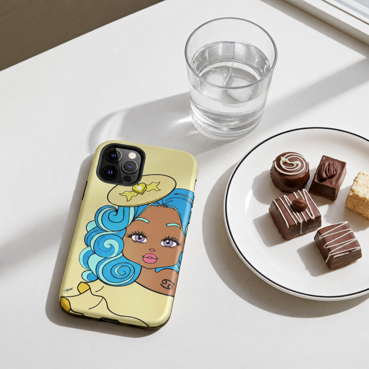 Phone case with a Cancerian design of a woman on a table with a glass of water and a plate of chocolates.