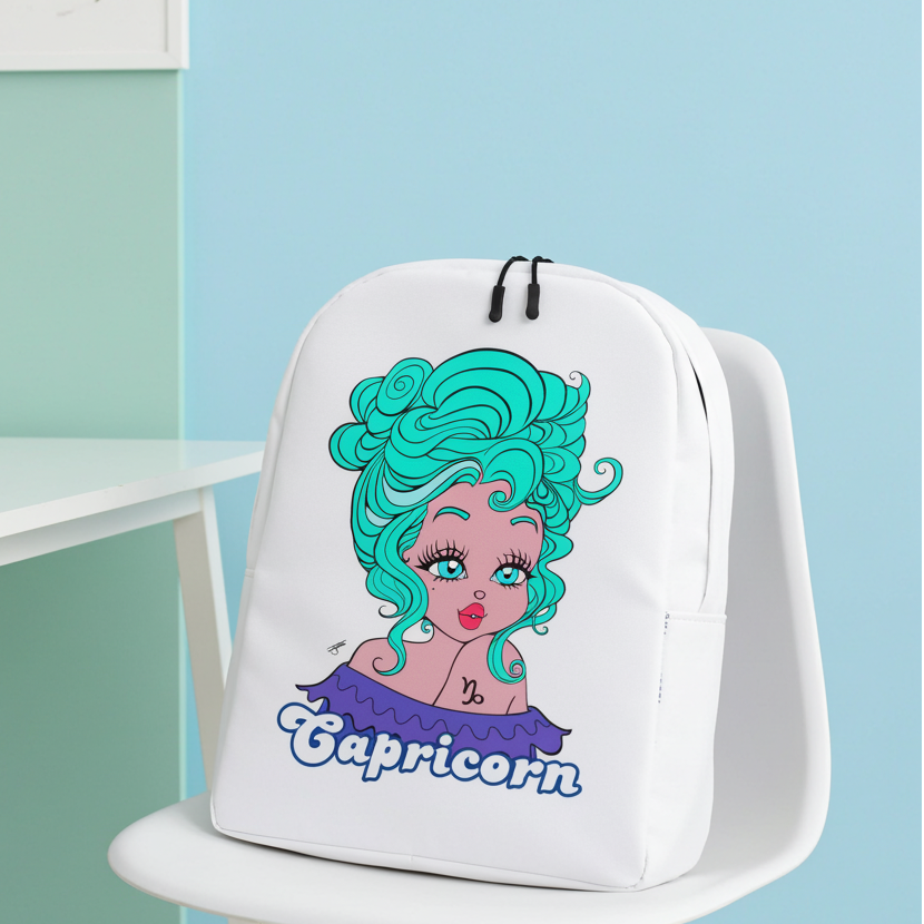 White backpack with Capricorn design on a chair against a pastel-colored wall.