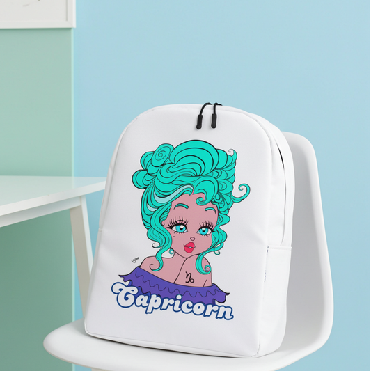 White backpack with Capricorn design on a chair against a pastel-colored wall.