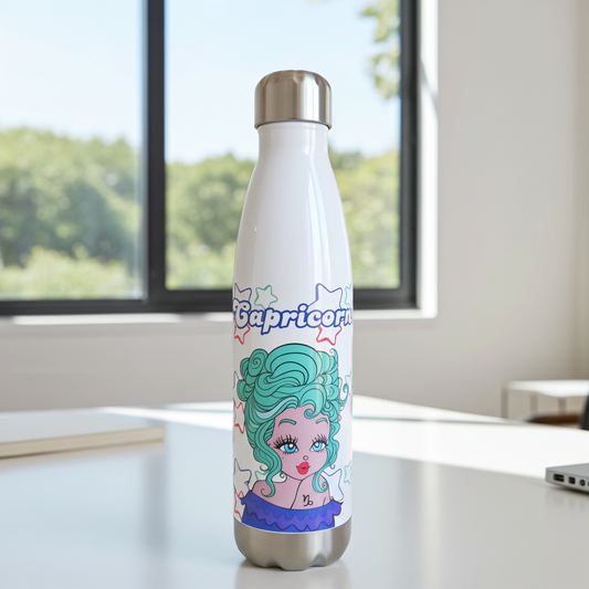 Stainless steel water bottle with Capricorn zodiac design on a desk with a window in the background