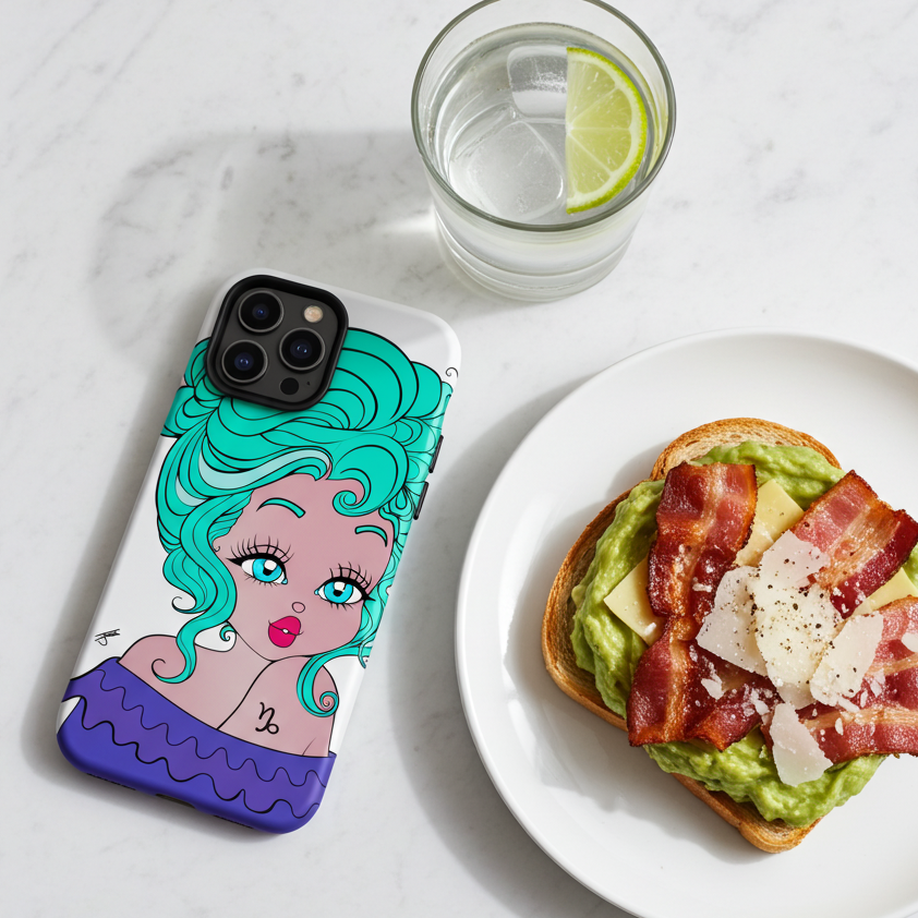 Phone case with a capricorn character design, avocado toast, and glass of water on a marble surface