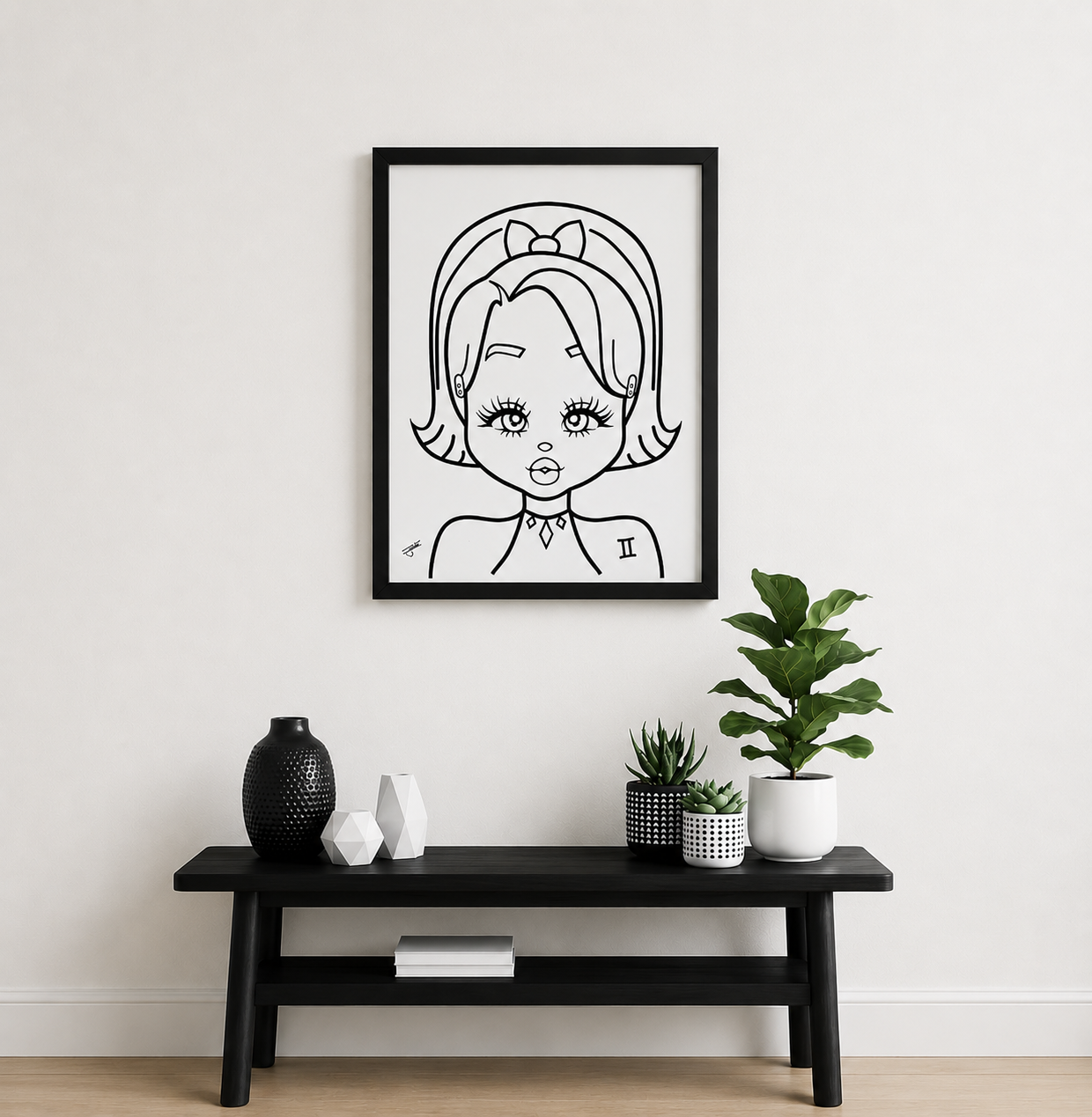 Framed line art of a Gemini character on a white wall above a black console table with decorative items.