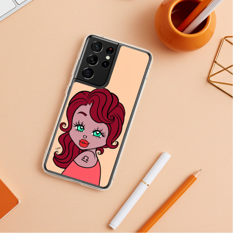 Phone case with a Libra character design on a desk with office supplies