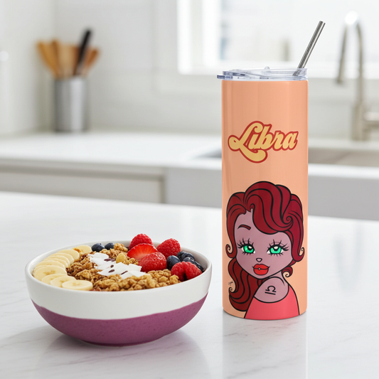 Cereal bowl with fruit and a 'Libra' themed tumbler on a kitchen counter.
