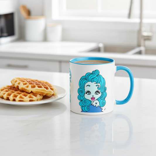 Mug with a Pisces character design on a kitchen counter with waffles.