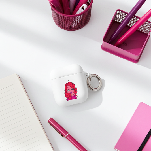White air pod case with a Sagittarius character keychain on a desk with pink pens and a notebook.