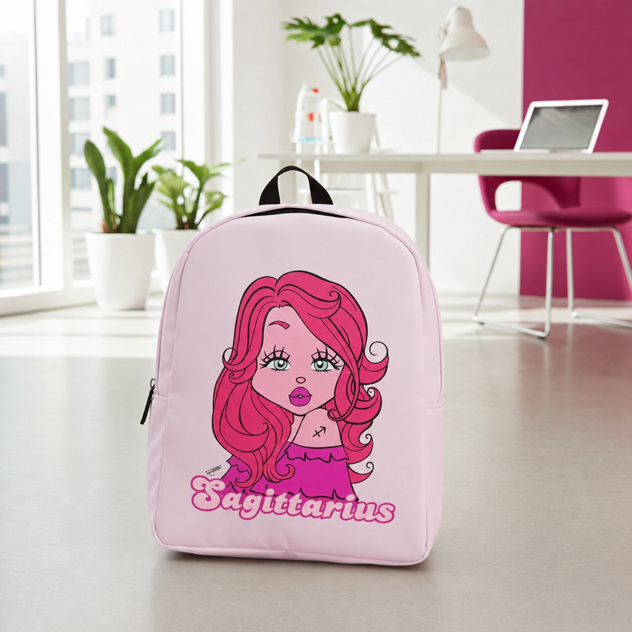 A light pink backpack with a cartoon girl illustration and the word 'Sagittarius' printed on the front, set in a bright, modern room with plants and a desk in the background.