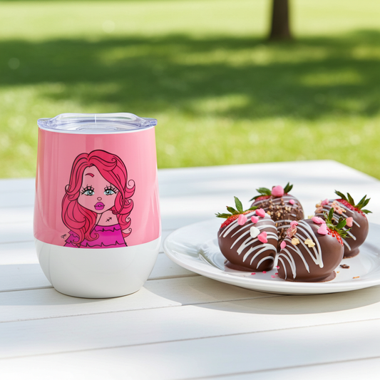 Pink tumbler with a Sagittarius character design next to a plate of chocolate-covered strawberries on a white surface outdoors.