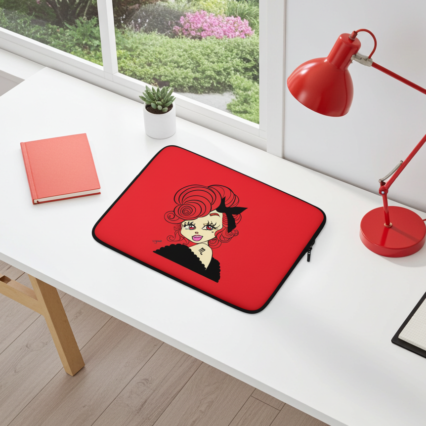 Laptop sleeve with a Scorpio character design on a white desk with a red lamp and notebook.