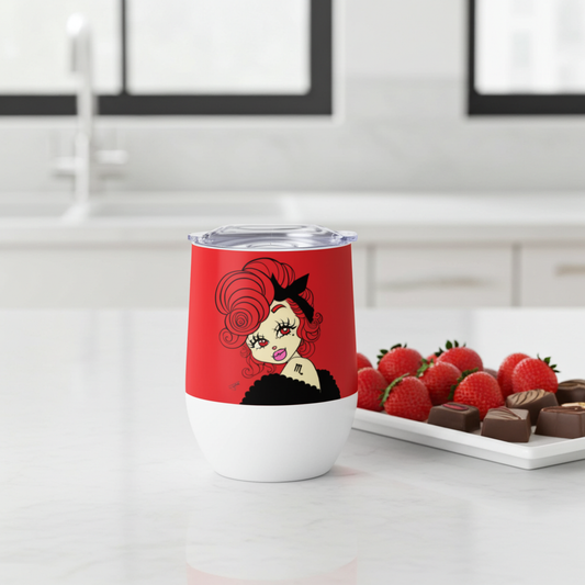 Tumbler with a Scorpio character on a white surface with strawberries and chocolates.