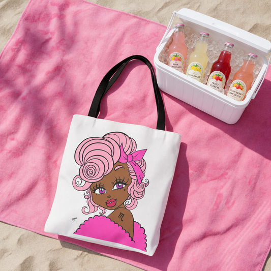 Tote bag with a Scorpio character on a pink towel with a cooler of drinks in the background