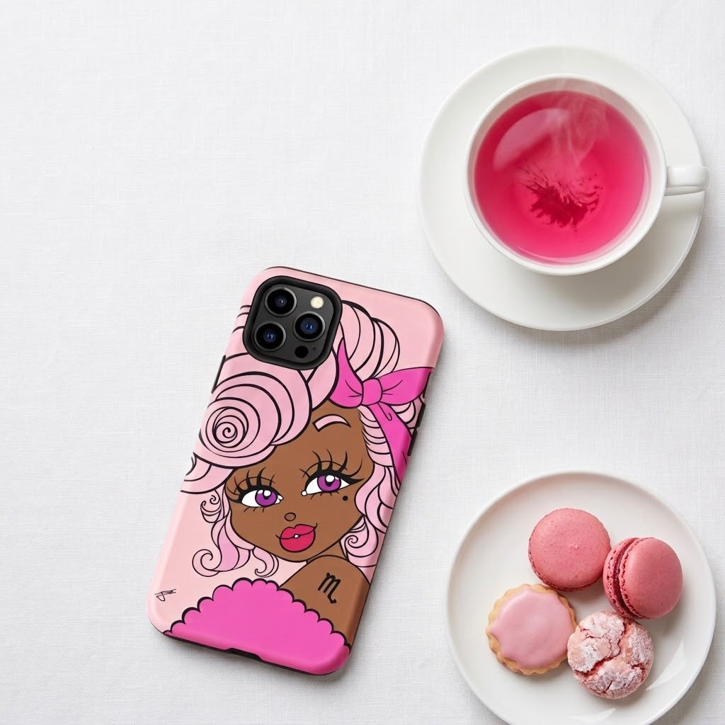 A pink phone case featuring a stylized illustration of a woman with pink hair and a pink bow, styled on a white surface next to a cup of pink tea and pink macarons.