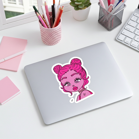 Laptop with a Taurus character on a desk with stationery items.