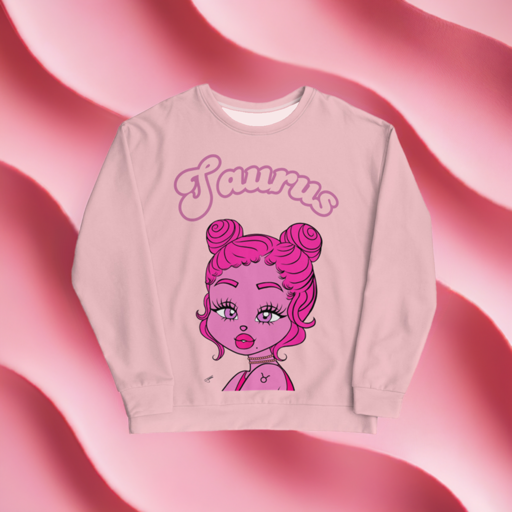 A pink sweatshirt with the text 'Taurus' and an illustration of a Taurus character with pink hair styled in buns.