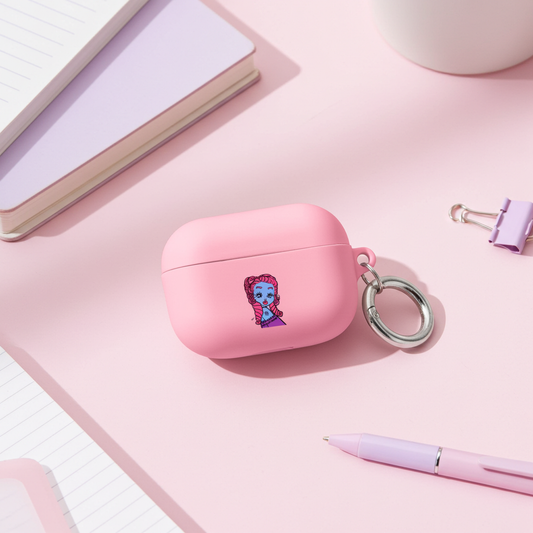 Pink wireless airpod case with a Virgo character design on a pink surface with stationery items.