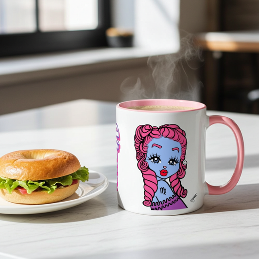 A white ceramic coffee mug with a pink handle and rim, featuring a colorful Virgo character, set on a white table next to a bagel sandwich with steam rising from the mug.
