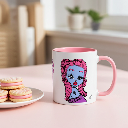 Mug with a colorful Virgo character design on a table with cookies