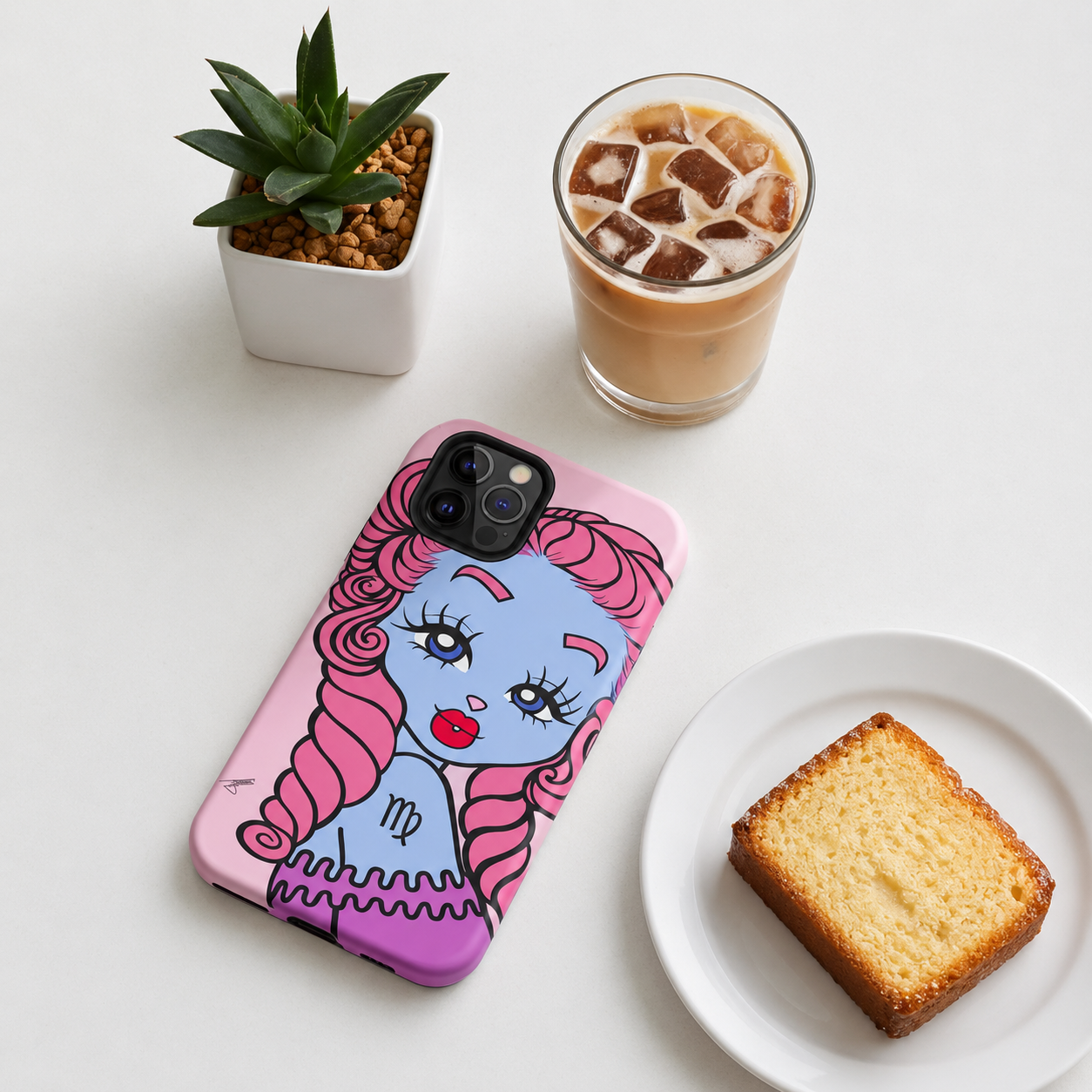 A pink phone case with a virgo character and pink hair, shown on a white surface with an iced coffee, a small potted succulent, and a slice of cake nearby.