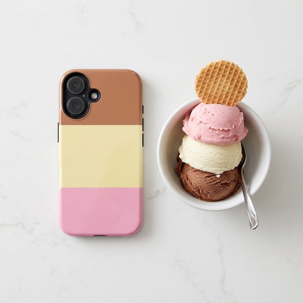 A phone case with horizontal brown, pale yellow, and pink color blocks is shown next to a white bowl of ice cream with a waffle on top, on a light marble surface.