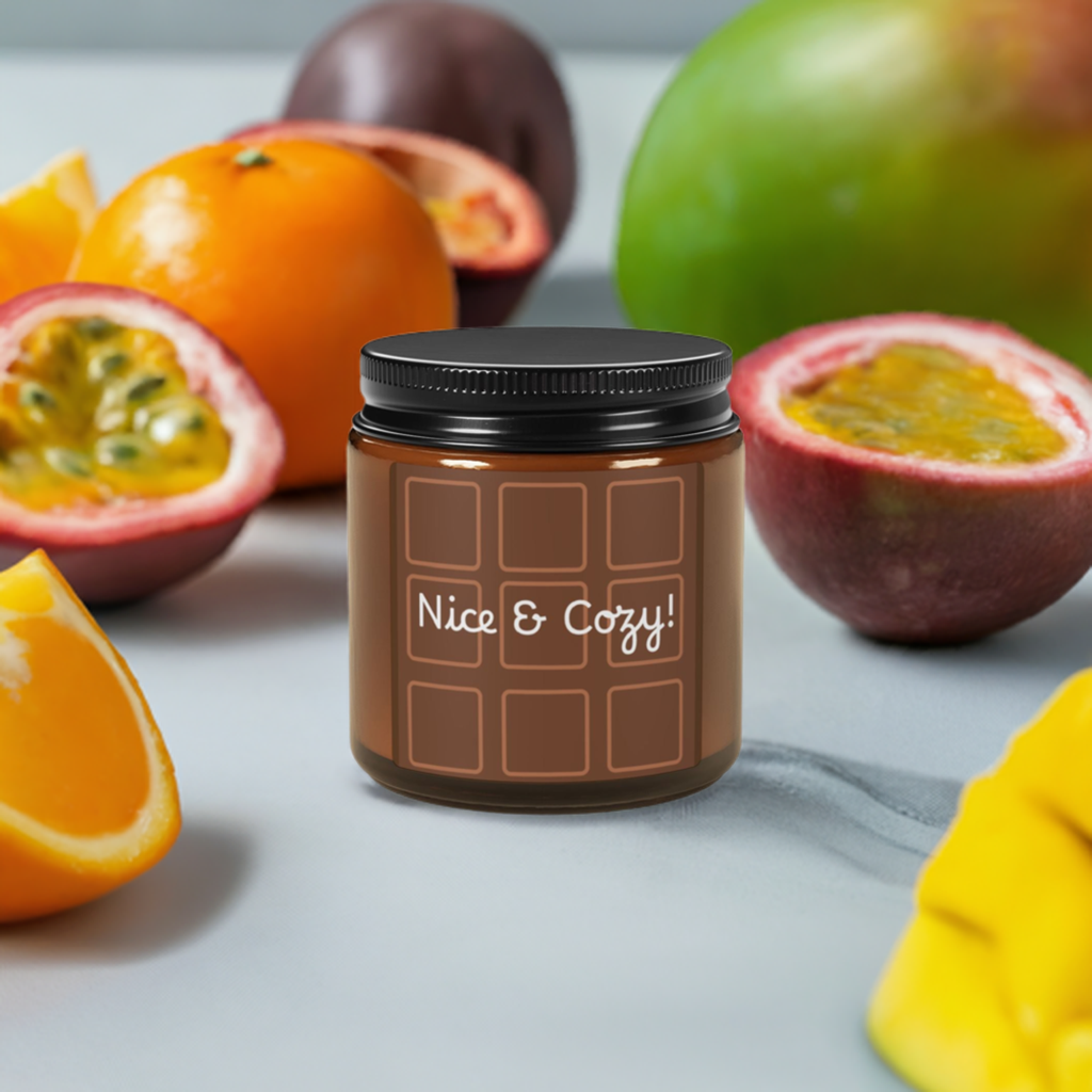 A brown glass jar with a lid labeled 'Nice & Cozy!' placed on a surface with various fruits around it, indicating a cozy and warm ambiance.