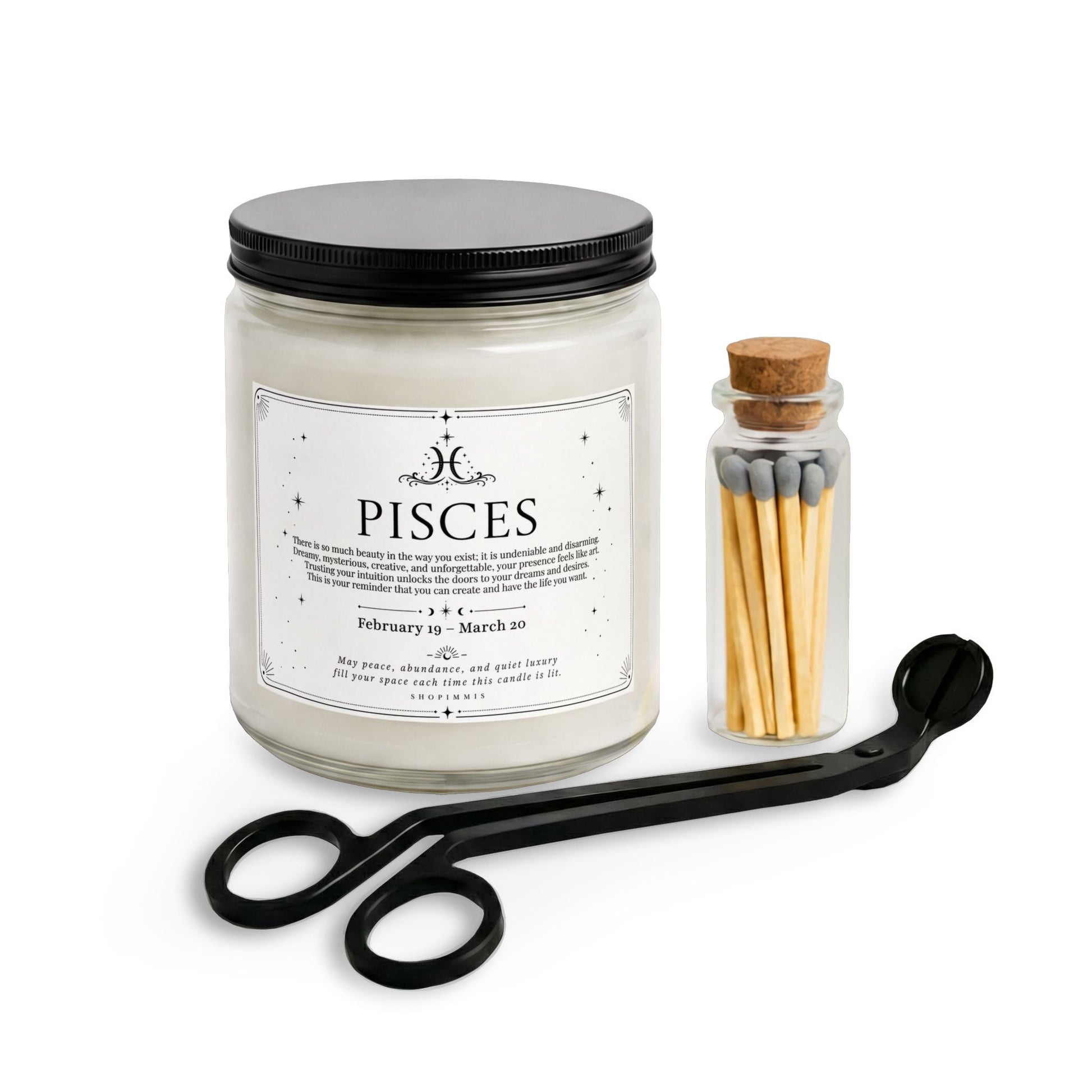 Pisces candle with black lid, matches in a small container, and scissors on a white background