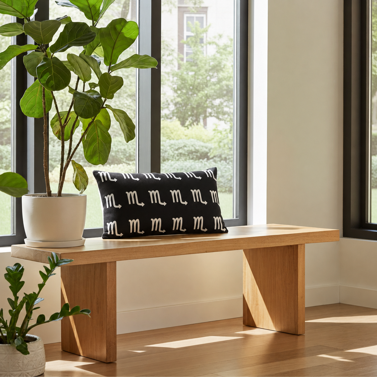 Wooden bench with a black pillow featuring white scorpio symbols, surrounded by potted plants in a bright room.