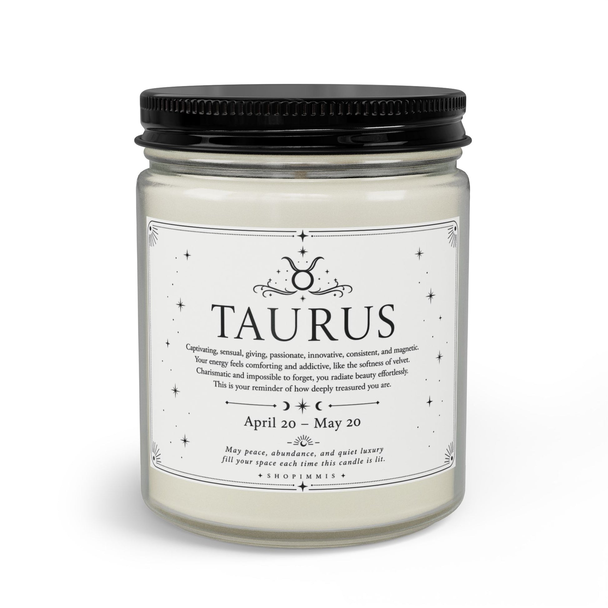 Candle jar with a label indicating 'Taurus' and astrological details on a white background