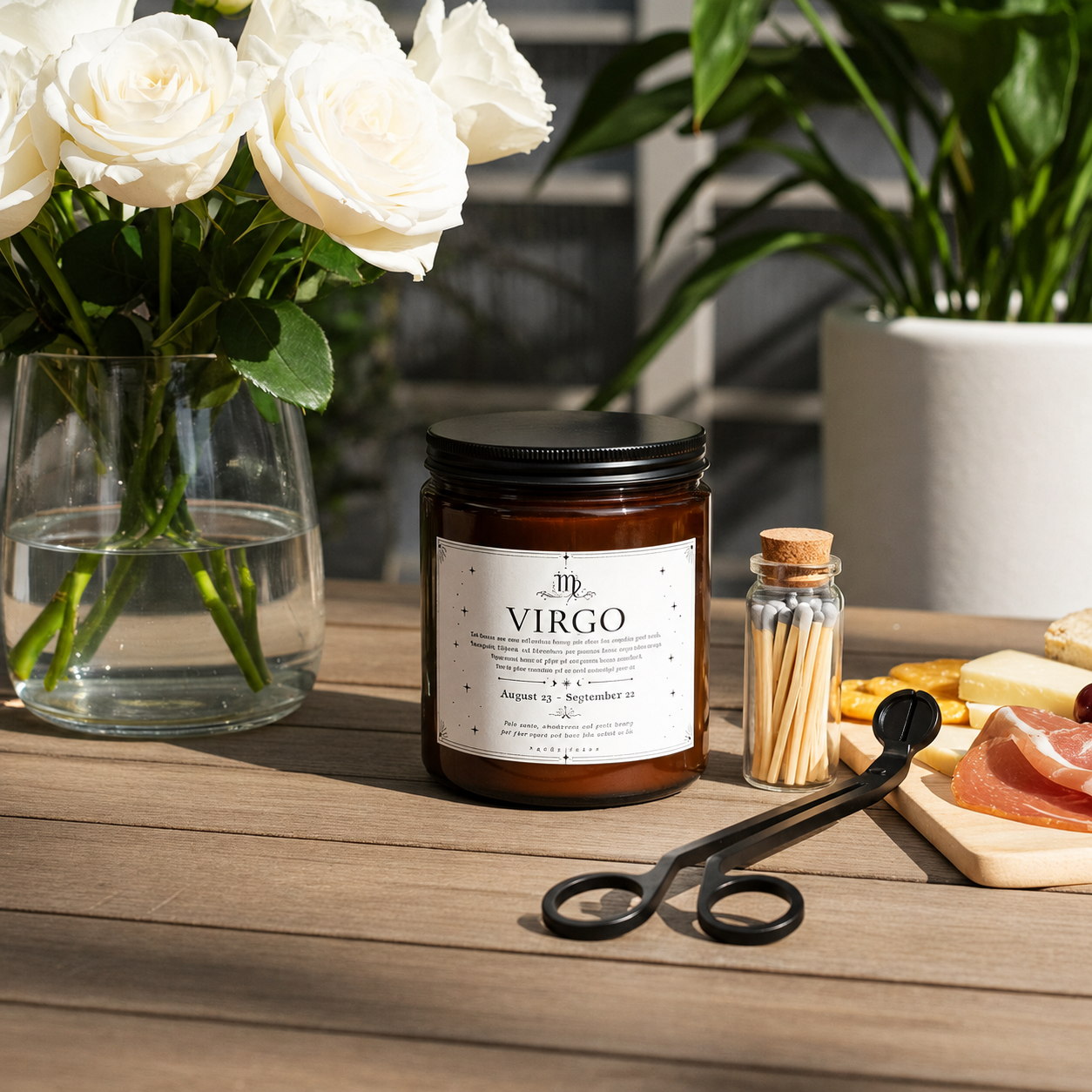 Candle labeled 'Virgo' on a wooden surface with flowers and matches in the background